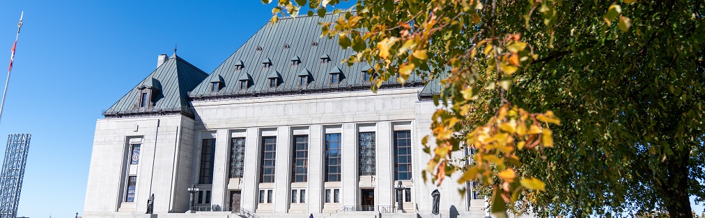 The exterior of the Supreme Court of Canada building in the fall